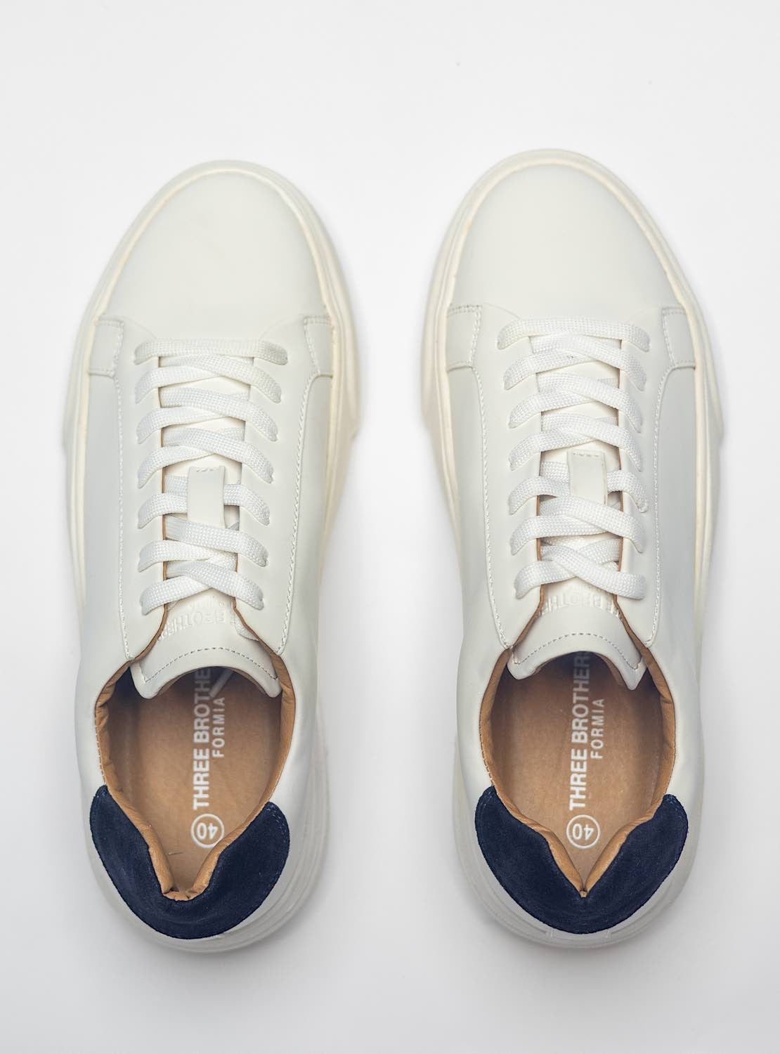 White Sneakers With Blue Back