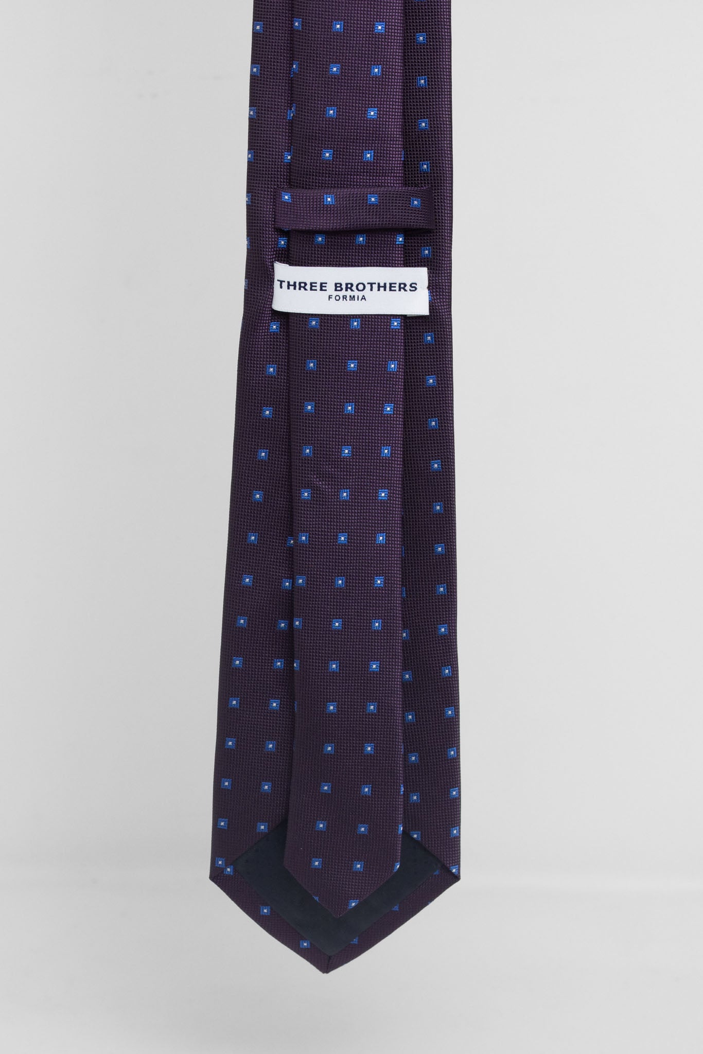 Cravatta Tre Pieghe Fantasia Geometrica Fondo Prugna e Azzurro | 2 Per €20